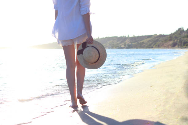 istock the girl is walking on the beach 1314177032