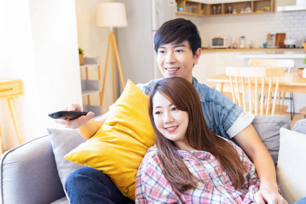 istock couple watch tv at home 1314177846