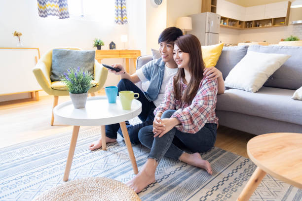 istock couple watch tv at home 1314178035