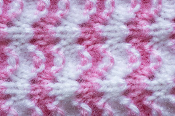 istock Pattern of pink knitted handmade baby clothes , knit pattern background, knitted texture backdrop 1314180979