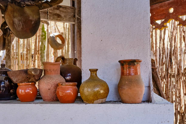 istock Old Caucasian pottery on a whitewashed oven in the yard. 1314187218