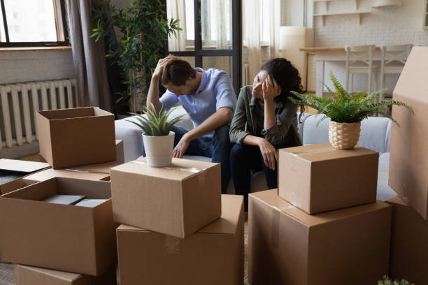 couple exhausted from packing