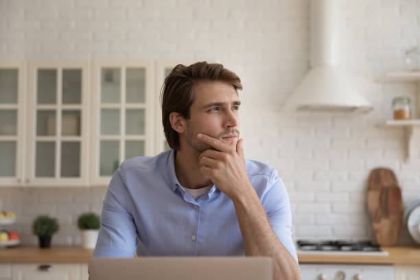 istock Close up thoughtful businessman looking to aside, pondering ideas 1314187292