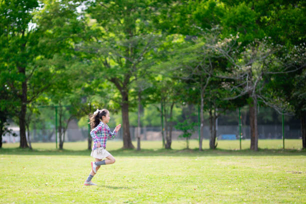 istock Girl dancing on the lawn 1314188877