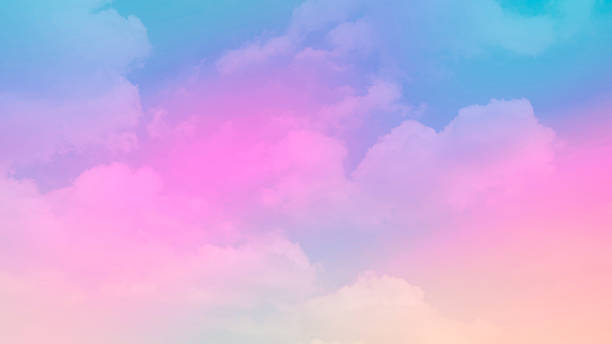 istock beauty sweet pastel soft yellow with fluffy clouds on sky. multi color rainbow image. abstract fantasy growing light 1314190357