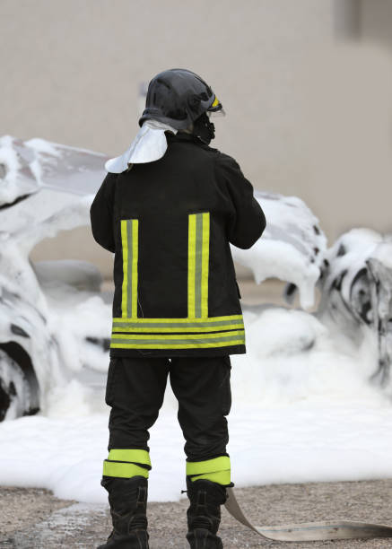 istock firefighter extinguishing a fire a damaged car with the foam 1314191510
