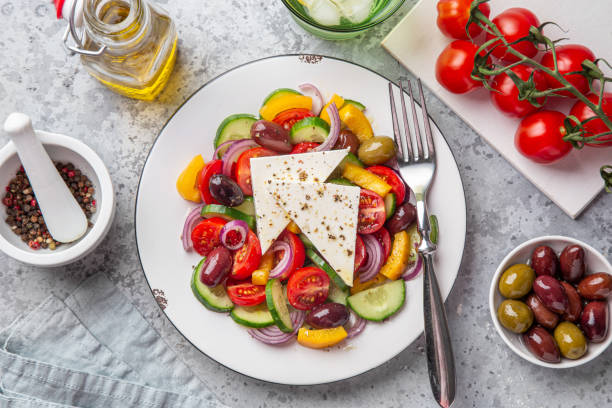 istock fresh vegetable salad ( tomato, cucumber, bel pepper, olives  and feta cheese) in white plate 1314192787