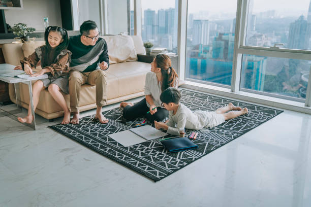istock asian chinese 2 parent bonding time teaching their 2 children doing homework 1314194890