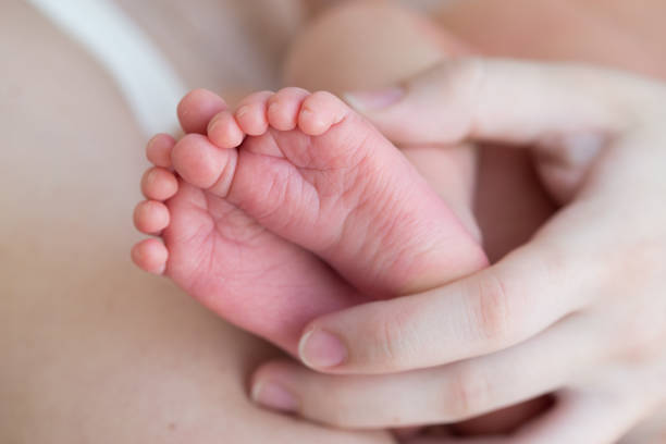 istock feet of a newborn 1314194911