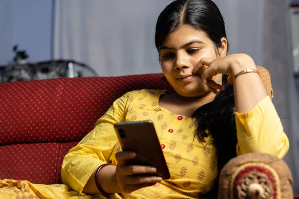 istock woman and smart phone 1314196973