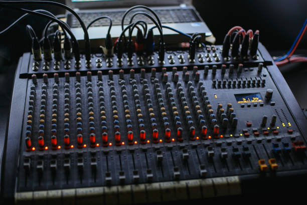 istock Professional audio studio sound mixer console board panel with recording , faders and adjusting knobs,TV equipment. 1314197227