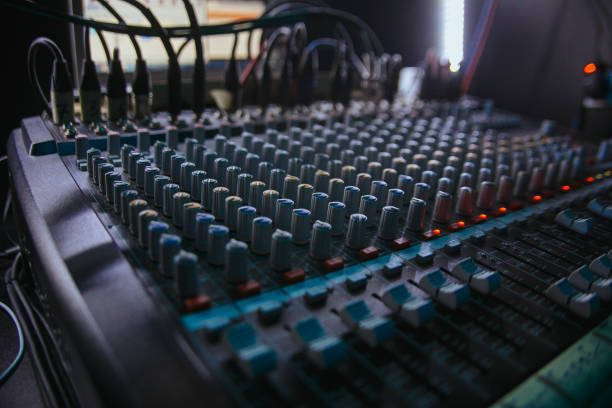 istock Professional audio studio sound mixer console board panel with recording , faders and adjusting knobs,TV equipment. 1314197272