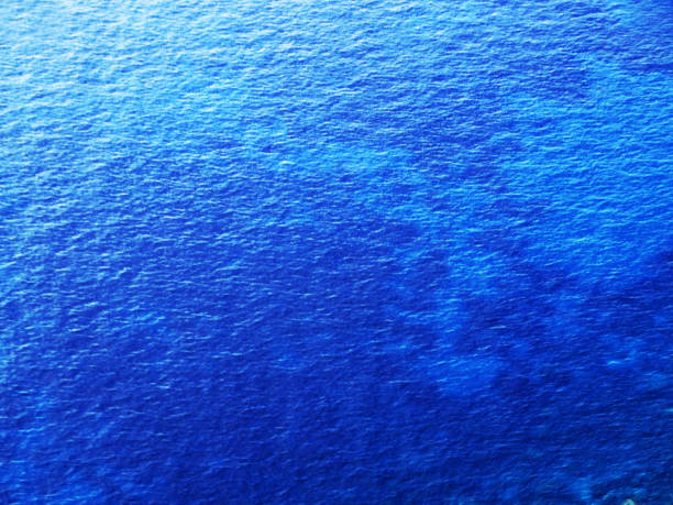 istock sea water waves summer background with hot sun blurred abstract bokeh 1314198523
