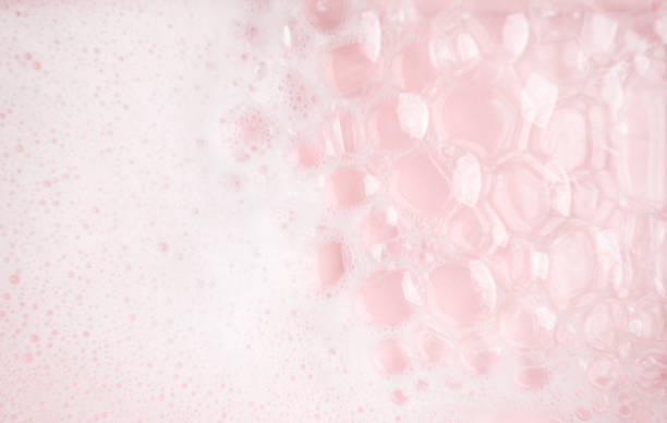 istock White foam bubbles texture on pink pastel background, copy space, banner for loundry, cleaning service, bathroom concept, clean, wash - liquid soap, shower gel, shampoo 1314199527