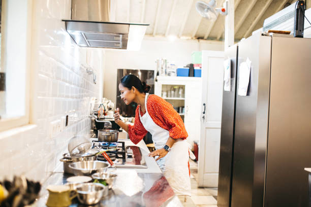 istock asian adult cooking in kitchen 1314200758