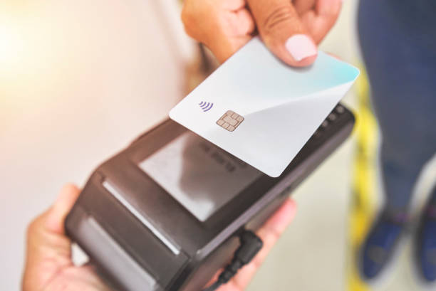 istock Close up of unrecognizable customer doing a contactless payment 1314200879