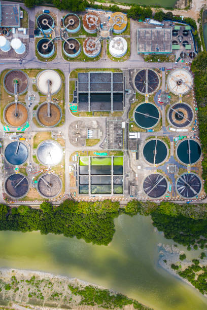 aerial photo of purification tanks of modern wastewater treatment plant - sewage pond imagens e fotografias de stock