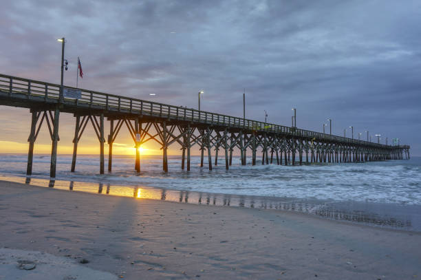 istock Sun rising under the pier 1314203001