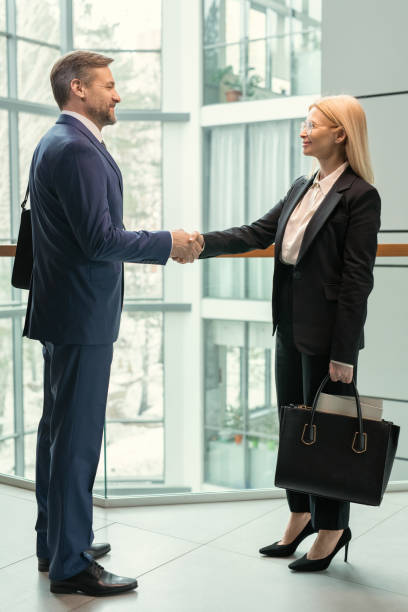 istock Business partners congratulating each other with contract 1314203163