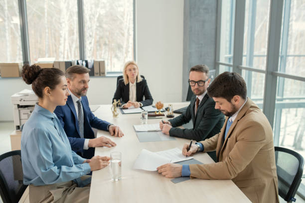 istock Signing document after discussion in judges office 1314203331