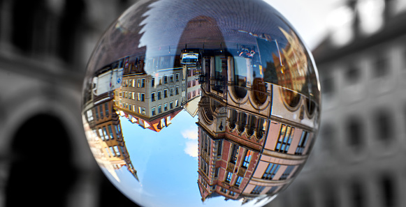 Town houses in the old town of Hanover, Germany, upside down through a glass ball