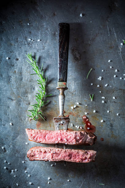 istock Cut in half steak served with salt. Medium rare steak. 1314204236