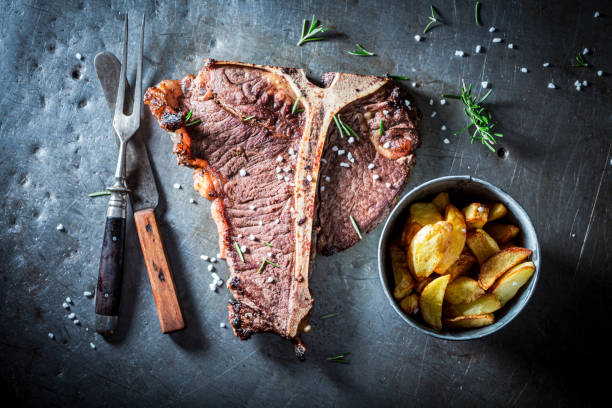 istock Well done tbone steak. Steak and chips with salt. 1314204311