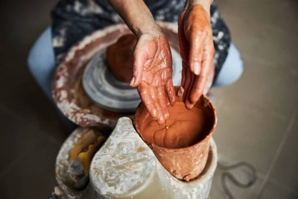 istock Senior woman hands making pottery in workshop 1314204377