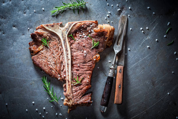 istock Well done tbone steak. Tbone steak with herbs and salt. 1314204682