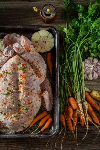 istock Roasted whole chicken with herbs. Ingredients for roasted chicken. 1314204691