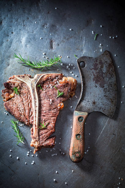 istock Delicious tbone steak with herbs. Well done tbone steak. 1314205368