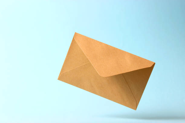 istock The envelope falls to the ground on a colored background. 1314205369