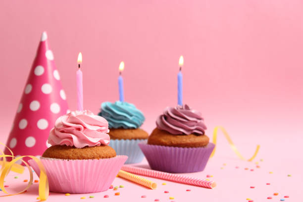 istock Delicious cupcake with a candle on a colored background 1314205519