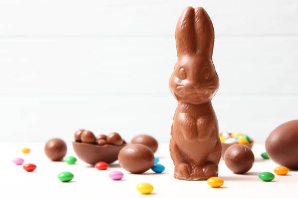 istock Easter composition with chocolate eggs and chocolate rabbit on wooden background 1314206475