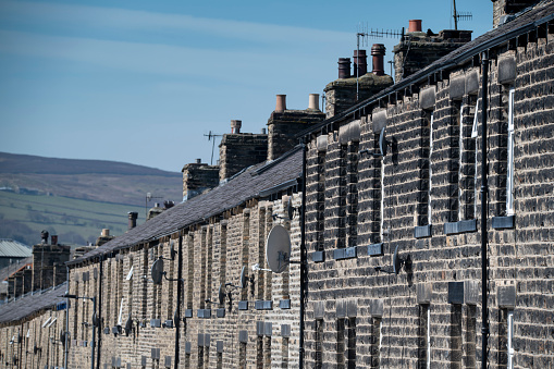 bricjk built Victorian terraced housing in Northern England complete with aerials and satellite dishes in summer