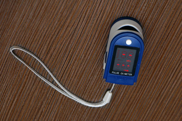 istock Pulse oximeter device on wooden background 1314209318