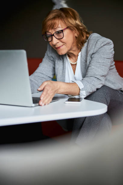 istock Positive delighted mature woman having video conversation 1314211384
