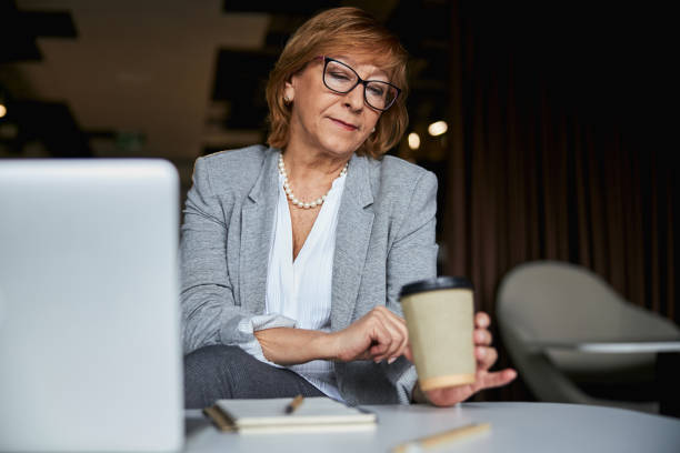 istock Attentive brunette woman staring at paper cup 1314211430