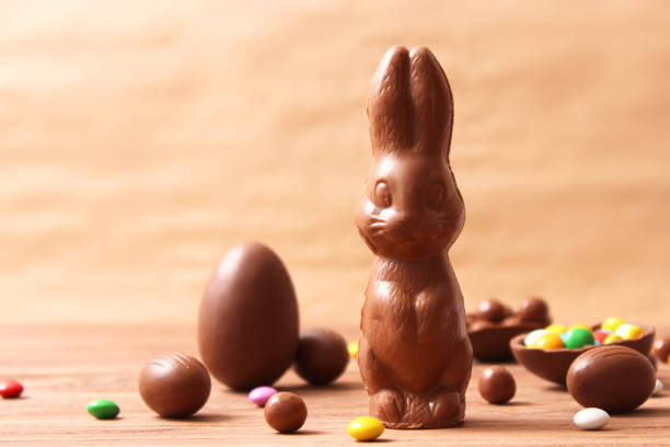istock Easter composition with chocolate eggs and chocolate rabbit on wooden background 1314211736