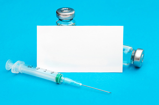 Blank card with vaccine vial and syringe. Space for text.