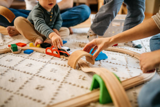 istock Family playing with a wooden railway 1314216991