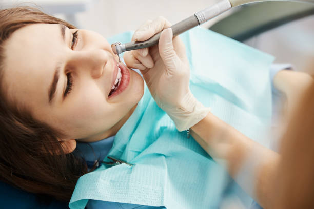 istock Doctor doing boring of a tooth with handpiece 1314217680