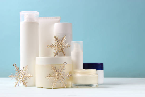 istock Winter care cosmetics on a colored background top view. 1314219646