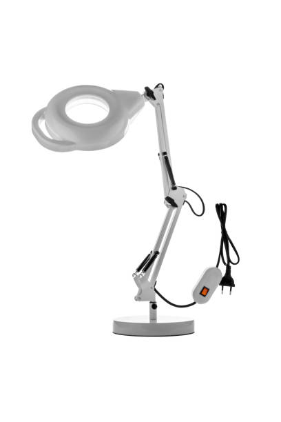 istock Table lamp with a magnifying glass. Magnifying glass with illumination on a white background. 1314221963
