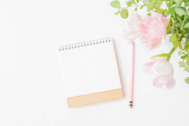 istock Mockup calendar and pink tulips in a vase on a light background 1314224083