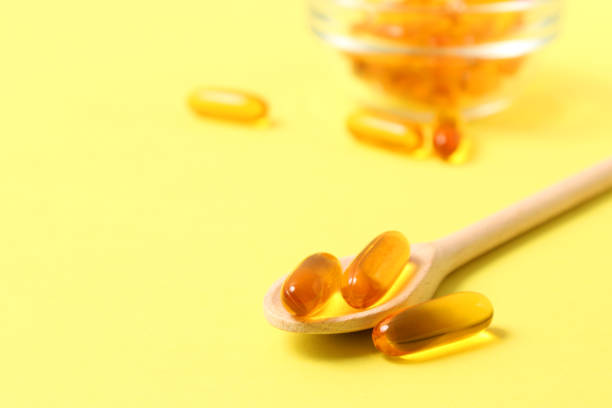 istock Omega-3 capsules on a colored background. Fish oil, healthy supplements 1314224999