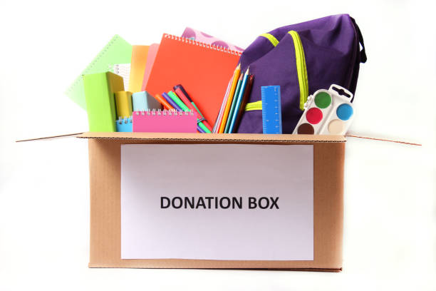istock donation box with school stationery items isolated on white 1314225942