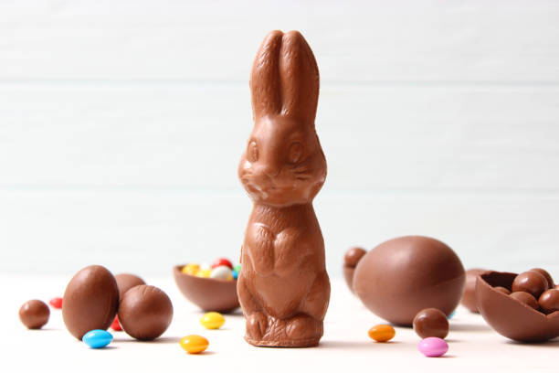 istock Easter composition with chocolate eggs and chocolate rabbit on wooden background 1314227868