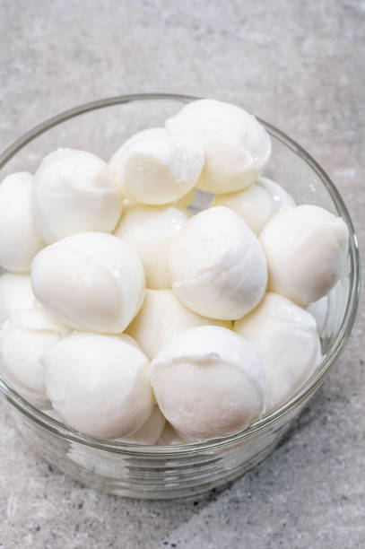 istock Cheese collection, small balls of fresh white soft Italian mozzarella cheese, ready for making caprese salad 1314233055