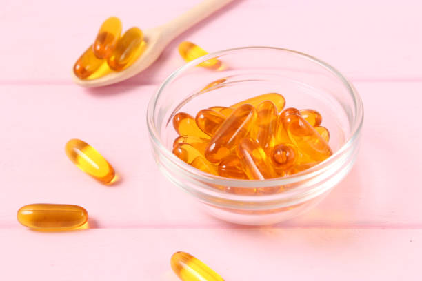 istock Omega-3 capsules on a colored background. Fish oil, healthy supplements 1314234119